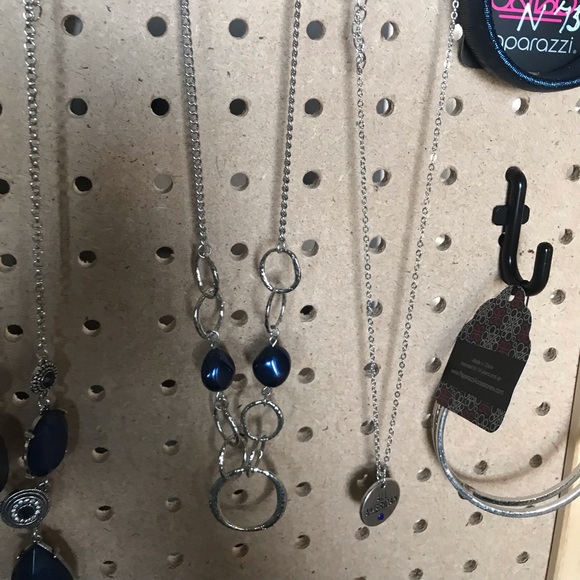 Silver necklace w/silver loops & blue beads.